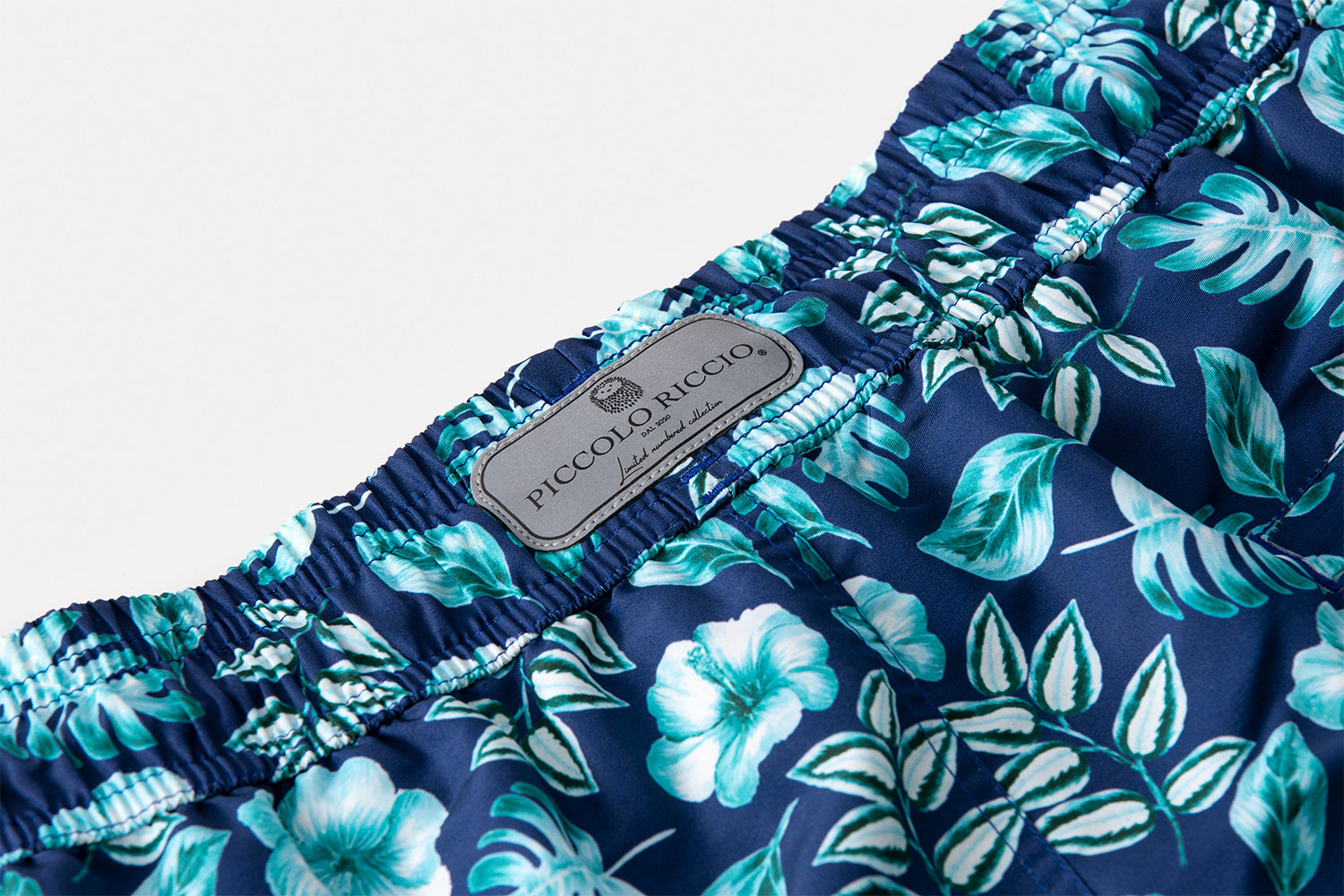 Reflective Limited Number Collection signature label of the PALAWAN luxury swim shorts by Piccolo Riccio.
